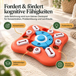 Denkspielzeug für Hunde mit Leckerlis in mehreren Fächern auf einem hellen Teppich